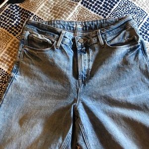 High rise wide leg fit. Light washed denim